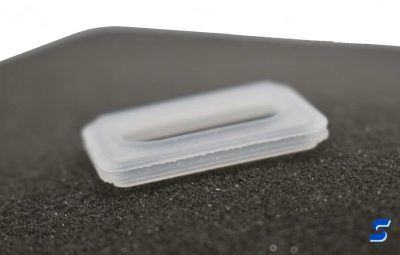 3D printed part showing perforation marks where supports were torn away