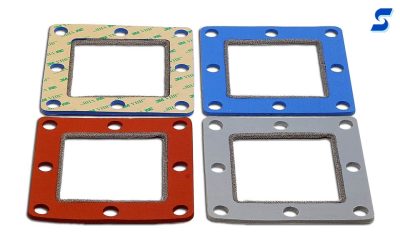 4 monel wire gaskets with monel wire around the inner edge, one shown opposit side with adhesive liner 