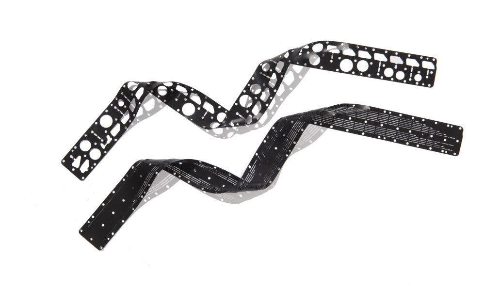 Long, black chemically resistant Viton gaskets with waterjet cut holes along the length