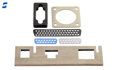 Black, gray, and blue sponge connector gaskets with arrays of pin holes 