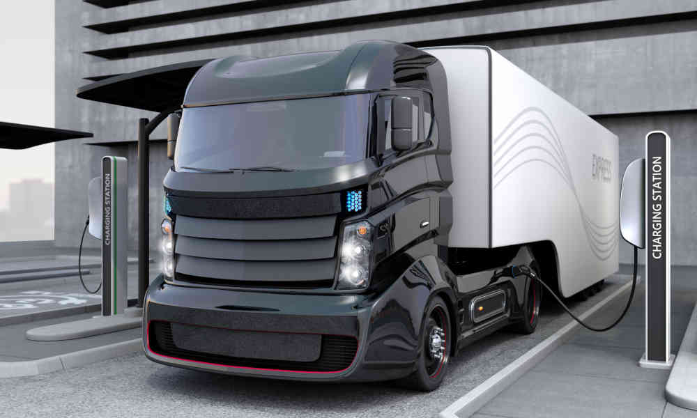 Rendering of an EV charging station with a carrier truck plugged in Rendering of an EV charging station with a carrier truck plugged in