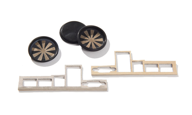 Gold-colored flectron film wrapped around a foam connector and bonded to a molded part 