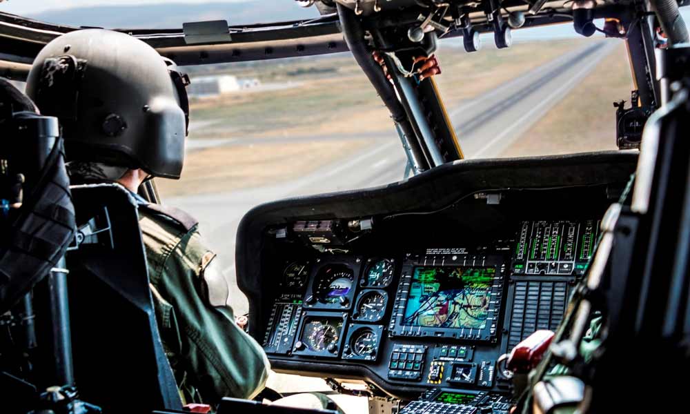 Pilot operating military helicopter Pilot operating military helicopter