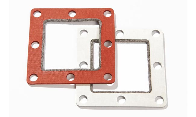 White and red sponge gaskets with monel wrap along the inside edge
