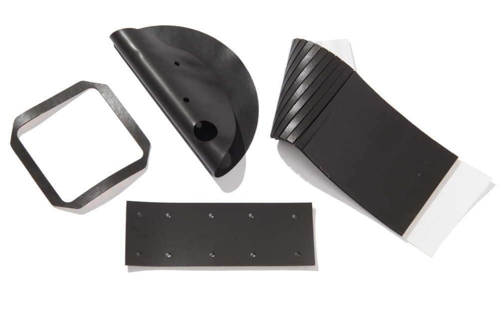 Group of black gaskets, circular, window, and kiss cut strips