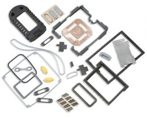 Portable device gaskets assortment: molded silicone shroud, silicone connector gasket, and molded silicone shock absorber for display on a portable data acquisition device