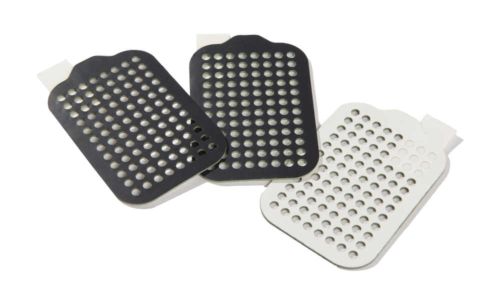 Sponge gaskets with Kapton tape and liner cut precisely with 30+ holes made using waterjet cutting