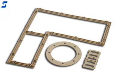 Various tan, silver aluminum filled gaskets 